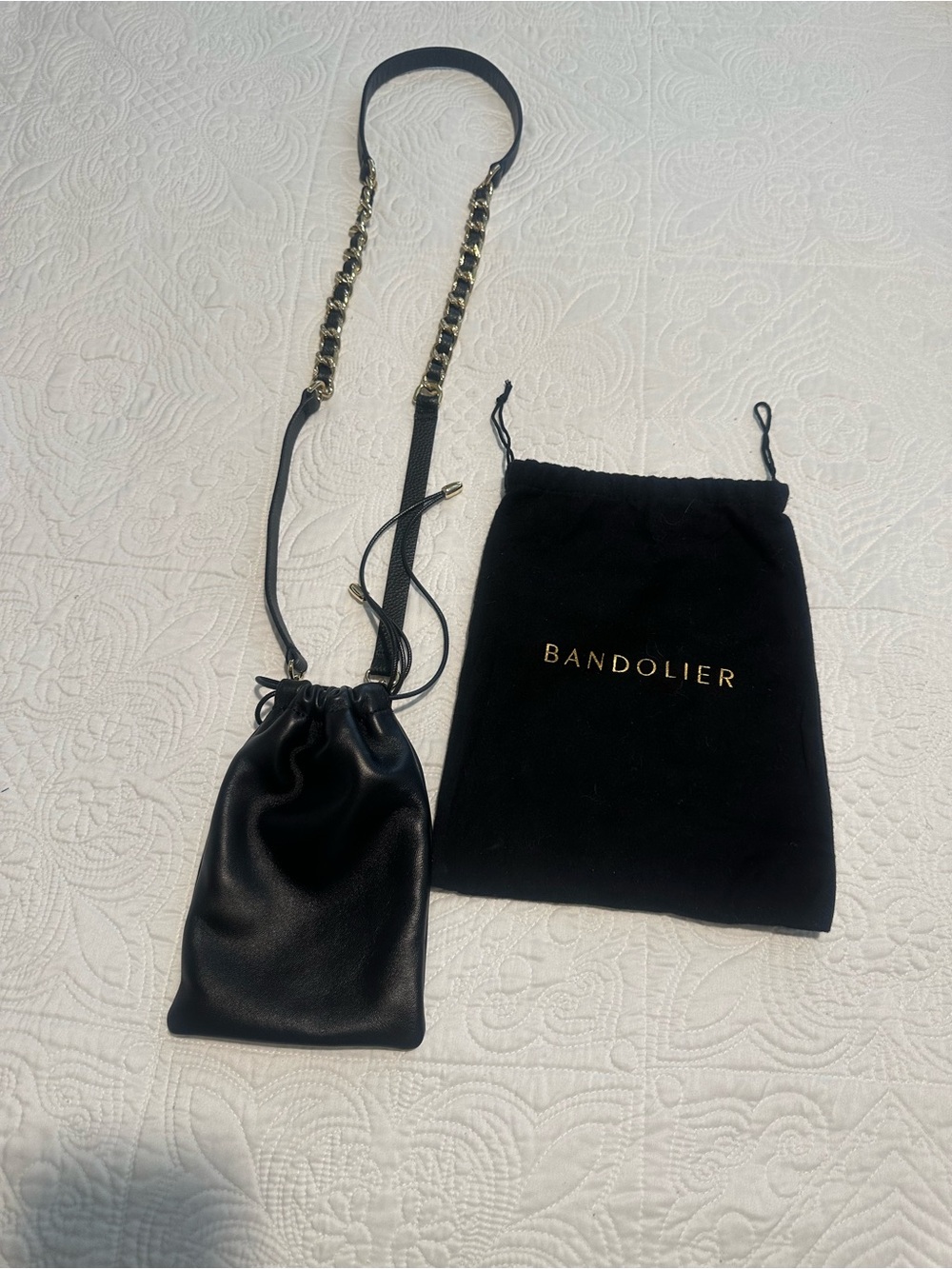 Bandolier Black Leather Mini Drawstring Crossbody with Gold Chain